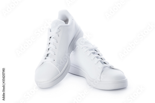 Pair of stylish sneakers isolated on white background. White casual shoes