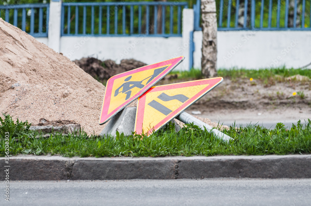 lying on the ground sign about roadworks lying on the ground sign about roadworks