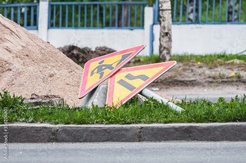 lying on the ground sign about roadworks