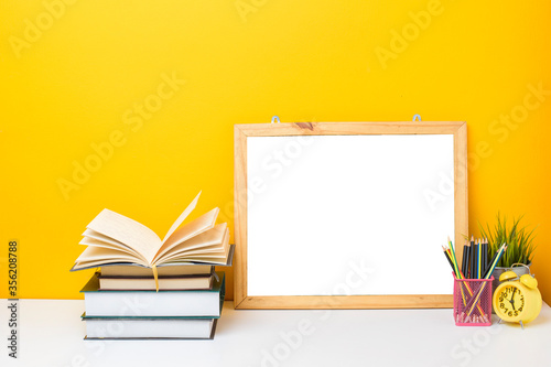 School equipment on yellow background with frame Mockup, Education background concept