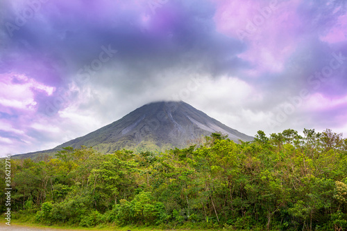 Amazing view of beautiful nature of Costa Rica with smoking volcano Arenal background. Panorama of volcano Arenal La Fortuna, Costa Rica. Central America.