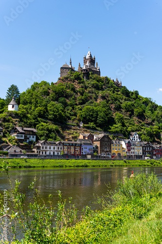 With the bike on the cycle path through the countryside along the river Moselle in Rhineland-Palatinate from Trier to Koblenz in summer