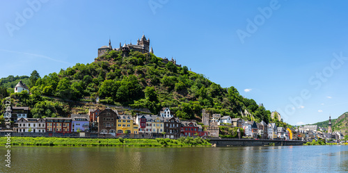With the bike on the cycle path through the countryside along the river Moselle in Rhineland-Palatinate from Trier to Koblenz in summer