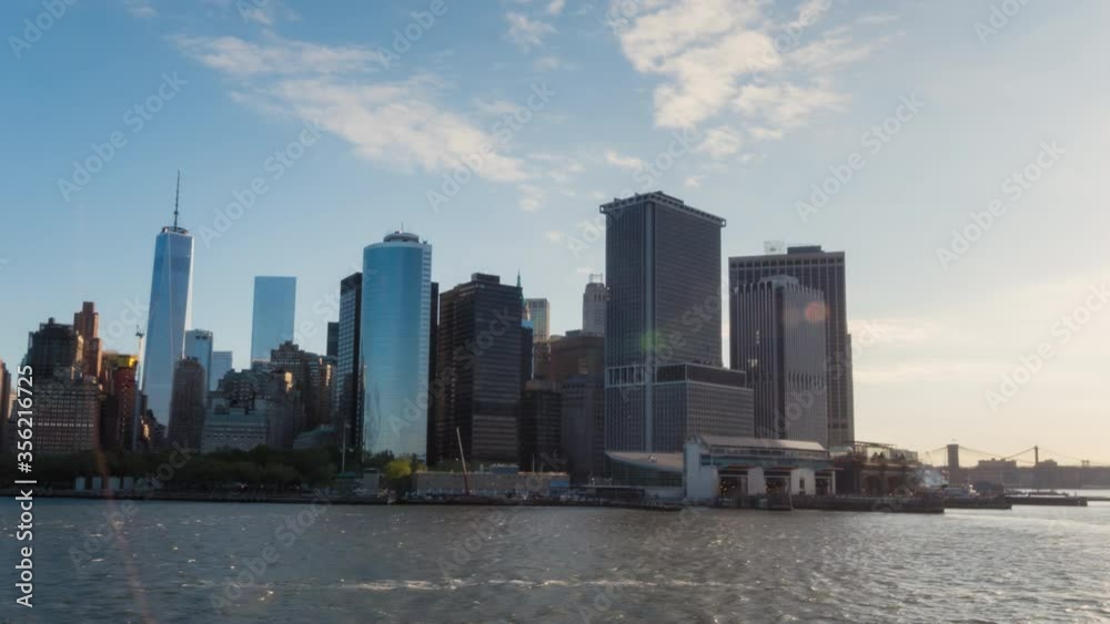 WS POV T/L Downtown Manhattan skyline with ferry terminal and One World Trade Center / New York City, New York, United States WS POV T/L Downtown Manhattan skyline with ferry terminal and One World Trade Center / New York City, New York, United States