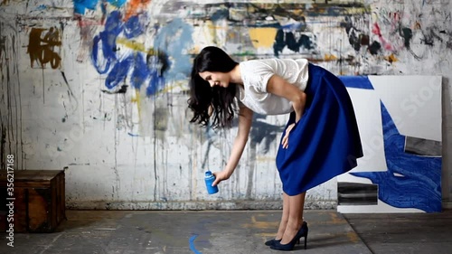WS Woman spilling paint on floor / Yekaterinburg, Ural, Russia photo