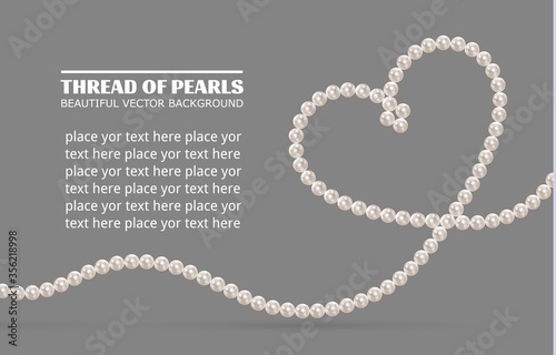 Shiny oyster pearls for luxury accessories. Pearl necklace thread of pearls. Realistic white pearls isolated on background. Beautiful natural heart shaped jewelry. Chains of pearls forming an ornament photo