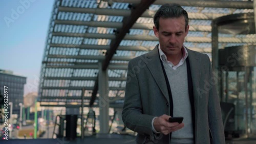 Wallpaper Mural MS TS Businessman walking in business district / Milan, Italy Torontodigital.ca