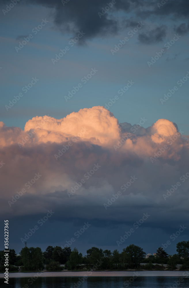 Beautiful magnificent clouds at sunset in the sky Beautiful magnificent clouds at sunset in the sky