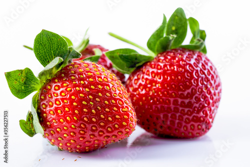 Close up Strawberry with green leaves on white background
