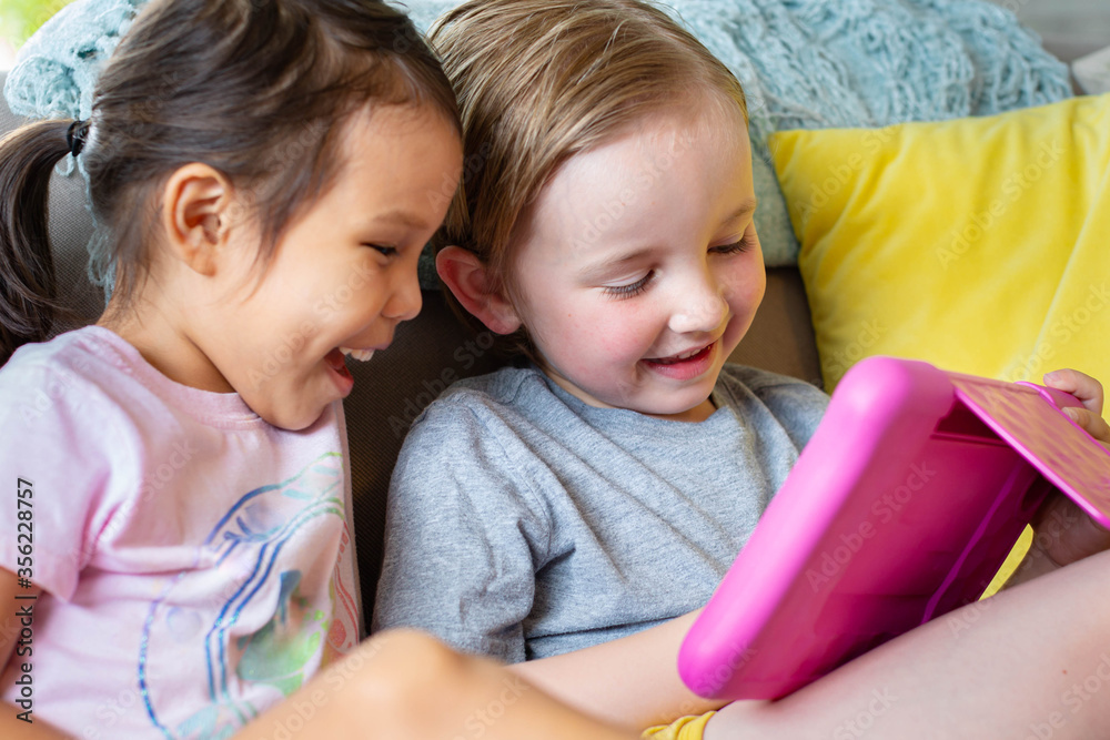 Children watching and playing educational videos and games. Learning at home. Children watching and playing educational videos and games. Learning at home.