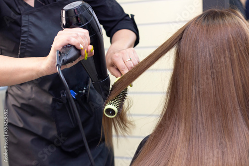 hair dryer drying. hair styling in a beauty salon. hair care.