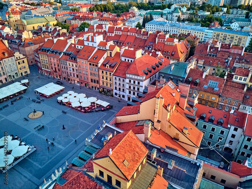 Beautiful panoramic aerial drone view on Warsaw Old town (POL: Stare Miasto) - the oldest district of Warsaw (13th century), Royal Castle, square and the Column of Sigismund III Vasa at sunset, Poland