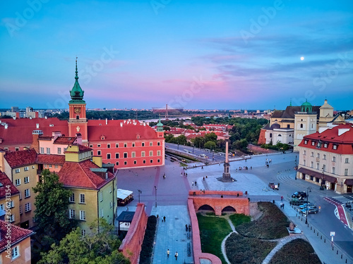 Beautiful panoramic aerial drone view on Warsaw Old town (POL: Stare Miasto) - the oldest district of Warsaw (13th century), Royal Castle, square and the Column of Sigismund III Vasa at sunset, Poland photo