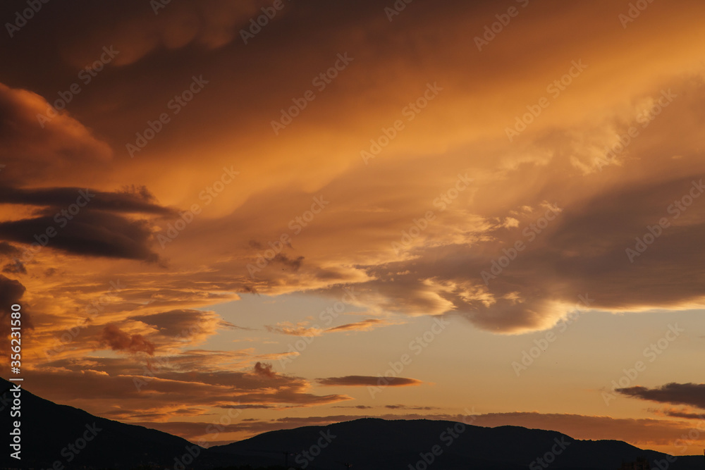 Cloudy sunset over the city of Sofia, Bulgaria. Warm colors sunset.