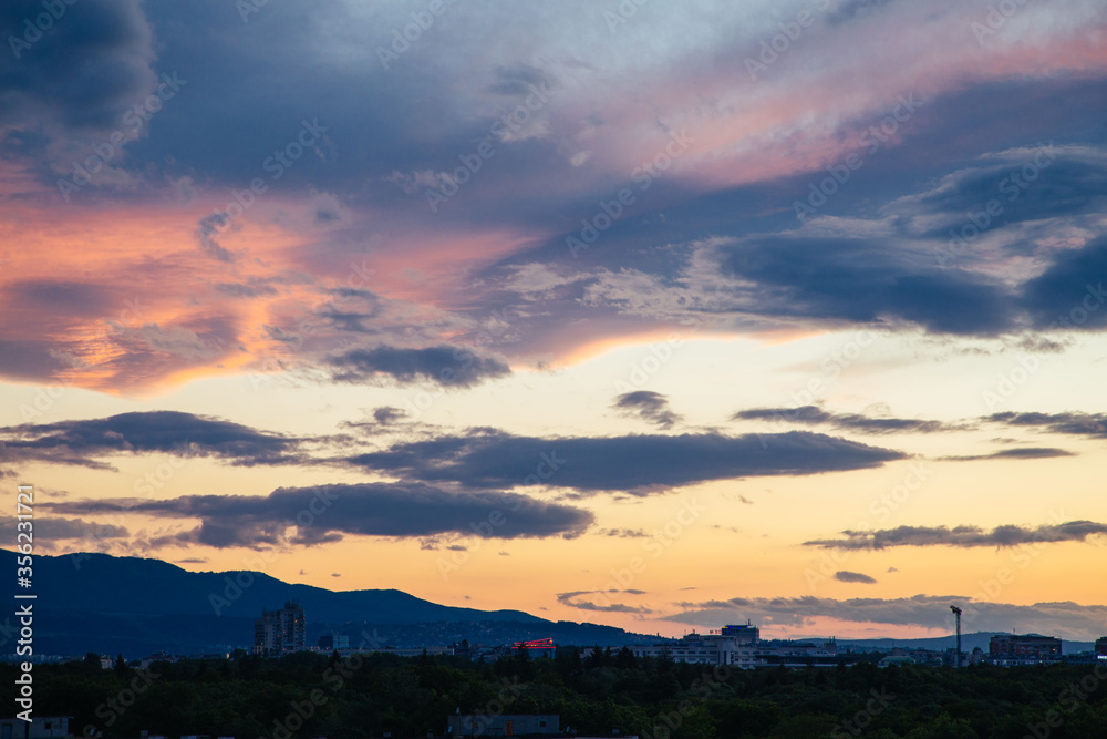 Cloudy sunset over the city of Sofia, Bulgaria. Warm colors sunset. Cloudy sunset over the city of Sofia, Bulgaria. Warm colors sunset.
