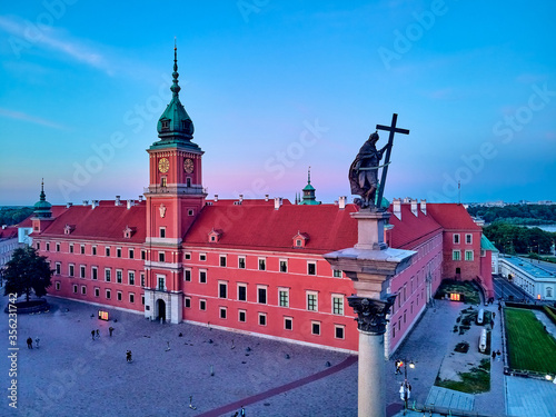 Beautiful panoramic aerial drone view on Warsaw Old town (POL: Stare Miasto) - the oldest district of Warsaw (13th century), Royal Castle, square and the Column of Sigismund III Vasa at sunset, Poland photo