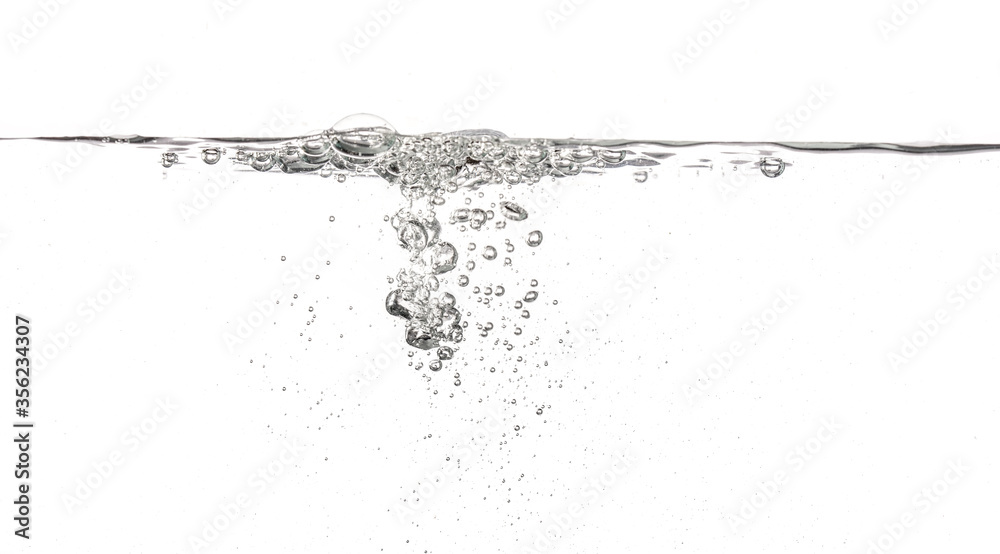 Water poured into tank, bubbles and splashes visible on white background Water poured into tank, bubbles and splashes visible on white background