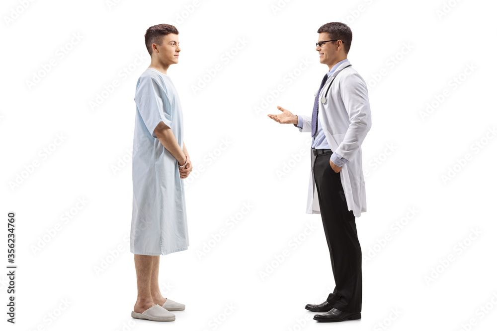Male doctor talking to a young male patient