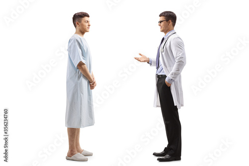 Male doctor talking to a young male patient