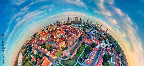 Beautiful panoramic aerial drone view on Warsaw Old town (POL: Stare Miasto) - the oldest district of Warsaw (13th century), Royal Castle, square and the Column of Sigismund III Vasa at sunset, Poland photo