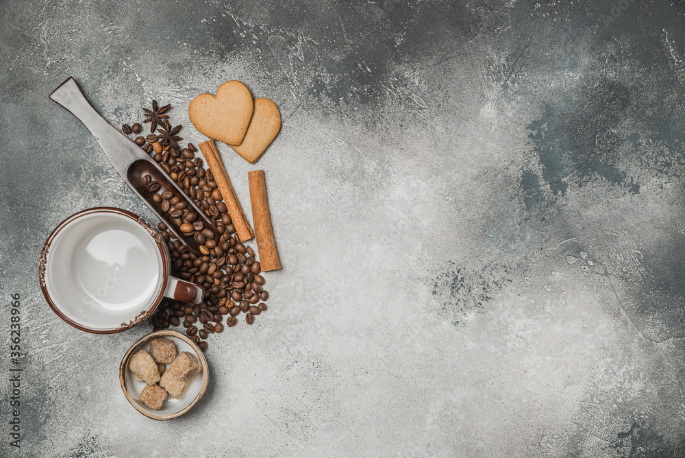 Top view of a Cup of coffee, cappuccino on a table with coffee beans with a wooden spoon