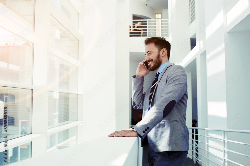 Intelligent male lawyer working on touch pad during work break