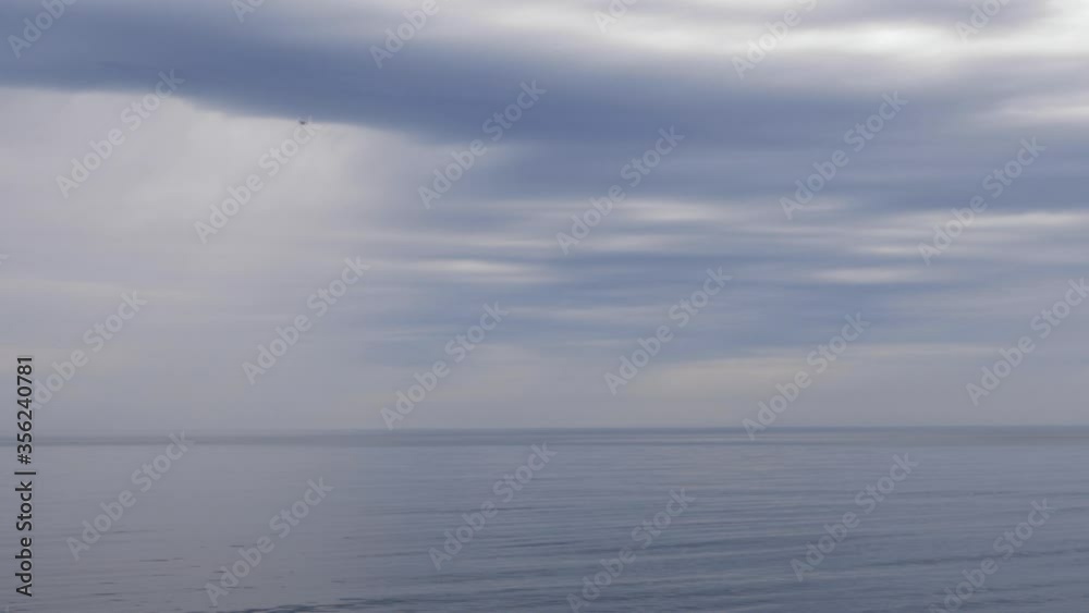 Sea coast during a storm with rain clouds Sea coast during a storm with rain clouds