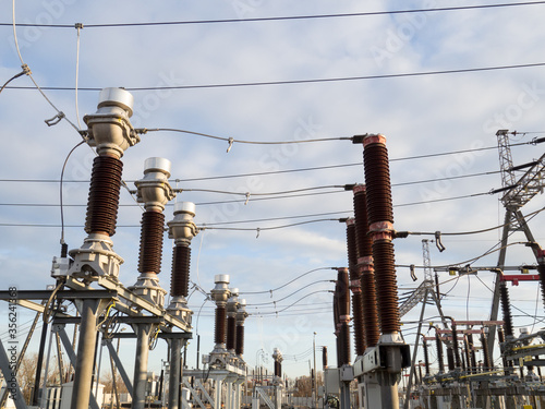 High voltage current transformers and cicriut breakers at power substation.