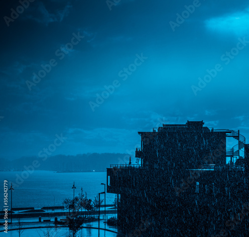 Photography Abstract photo. Blue colored building in rain.