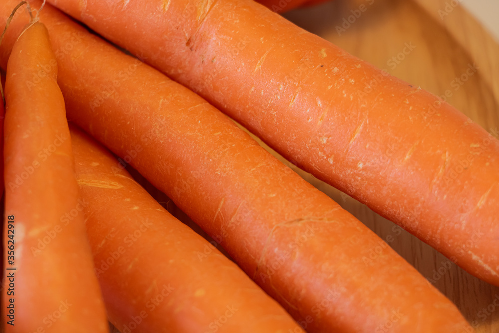 Close Up of Carrots on Wooden Plate Vegetables Vegan Food Close Up of Carrots on Wooden Plate Vegetables Vegan Food