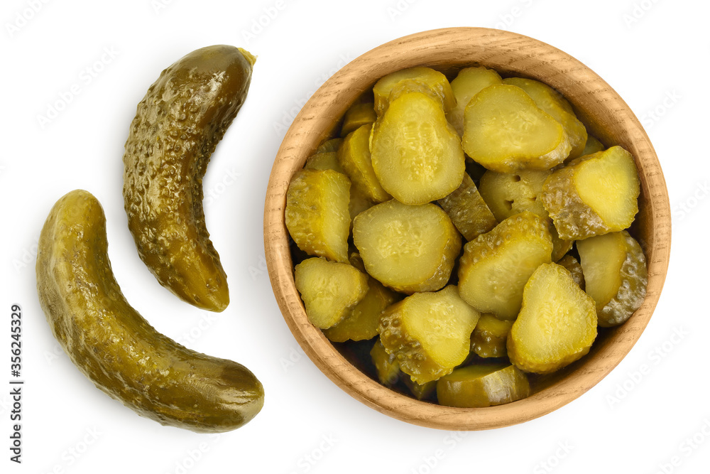 Marinated pickled cucumber in wooden bowl isolated on white background with clipping path and full depth of field. Top view. Flat lay Marinated pickled cucumber in wooden bowl isolated on white background with clipping path and full depth of field. Top view. Flat lay