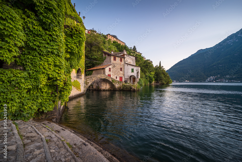 Scenic picture of Nesso on the Como lake in Italy with stone foreground