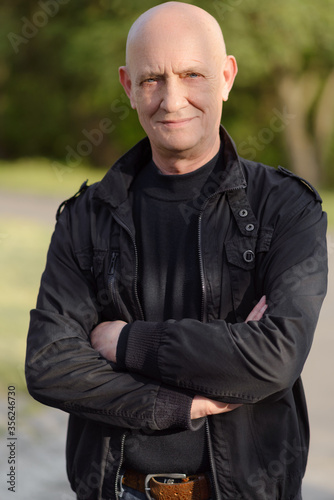 A man that is standing in the grass. High quality photo