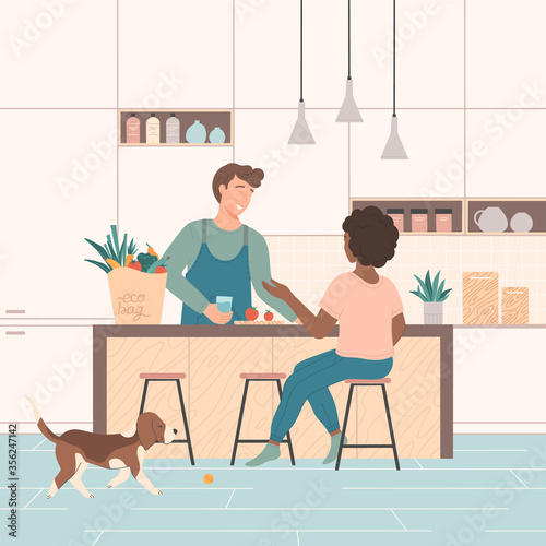 Cute couple spending time together in kitchen,cooking and chatting.Smiling man and woman preparing food for dinner.Dog wants to play.Happy family.Healthy lifestyle.Flat cartoon vector illustration. © Xenia Artwork 