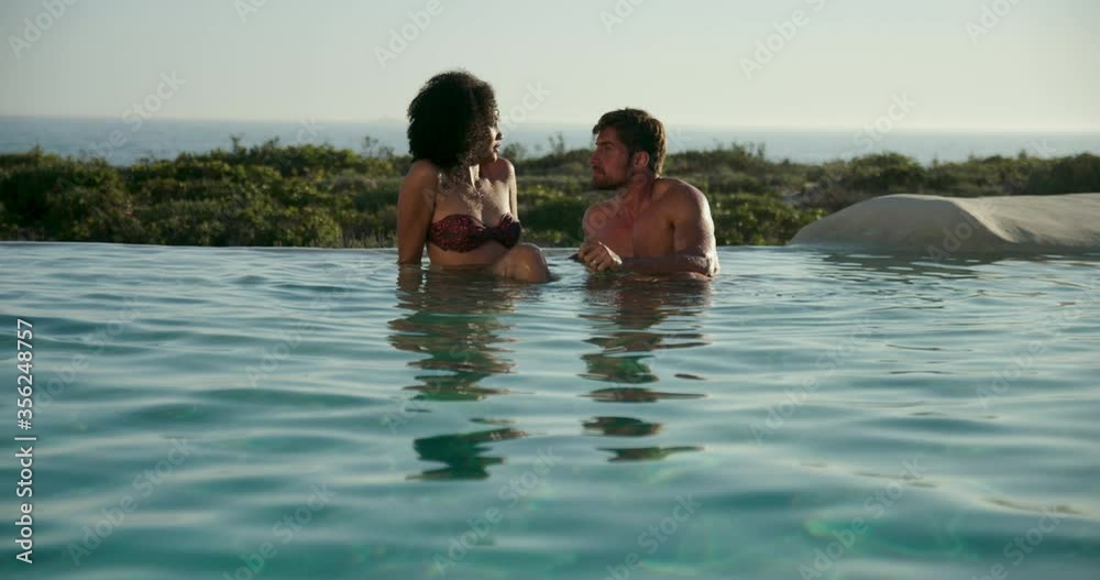 WS Couple sitting in pool / Claremont, Cape Town, South Africa WS Couple sitting in pool / Claremont, Cape Town, South Africa