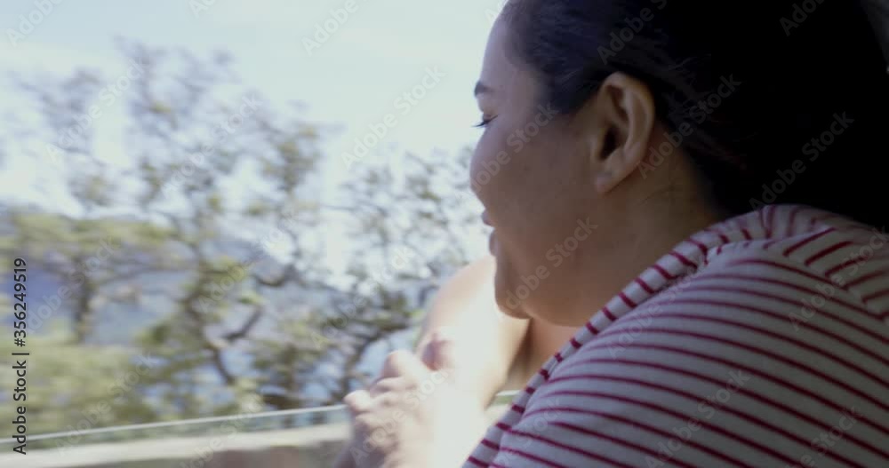 MS Woman traveling by car, looking through window / Cape Town, South Africa MS Woman traveling by car, looking through window / Cape Town, South Africa