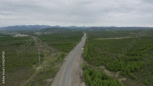 Flight on a drone over the Kolyma highway connecting the villages of Palatka and Stekolniy. The Far East of Russia. photo