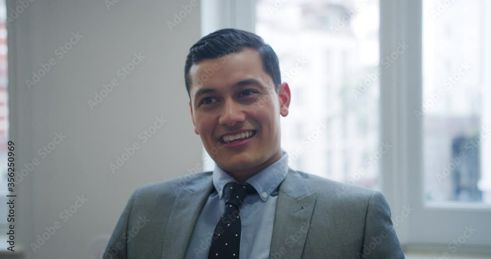 CU Businessman smiling / Covent Garden, London, England, United Kingdom CU Businessman smiling / Covent Garden, London, England, United Kingdom