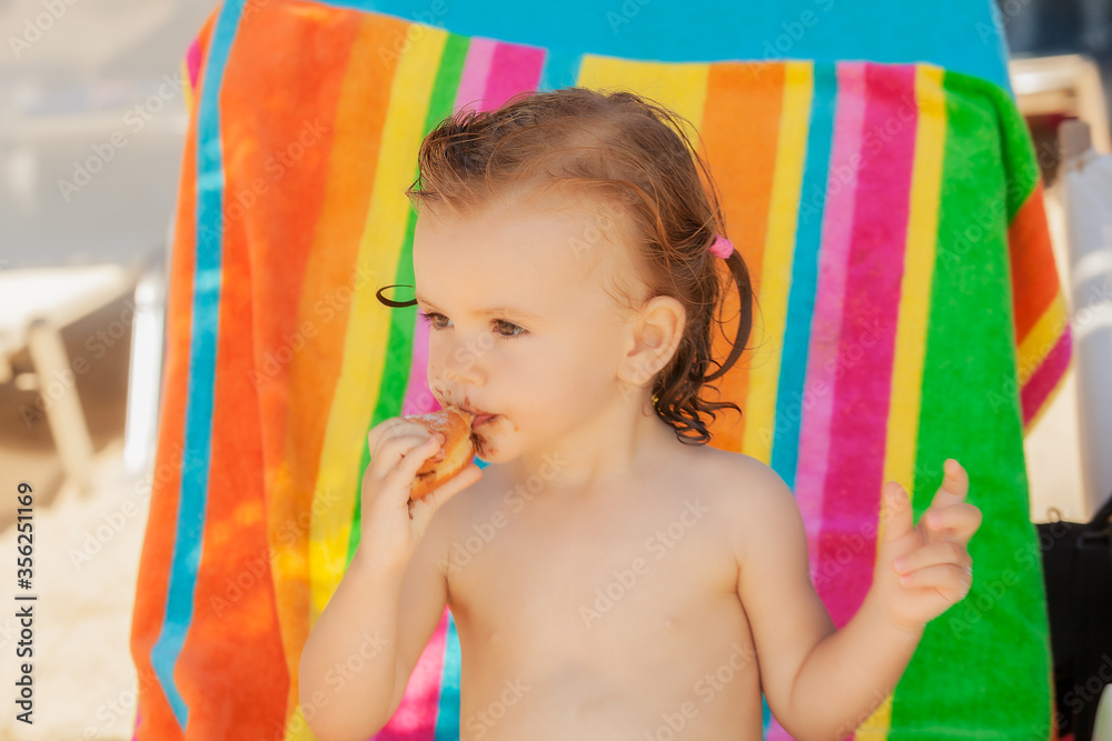 baby eating a donut