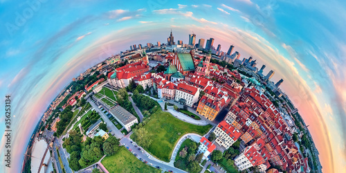 Beautiful panoramic aerial drone view on Warsaw Old town (POL: Stare Miasto) with modern skyscrapers on the horizon, Royal Castle, square and the Column of Sigismund III Vasa at sunset, Poland photo