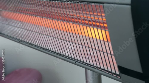 electric heater is working in a room, using electric heater to warm up,