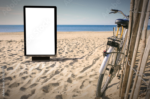 Blank advertising mockup in the street . Poster billboard on the beach background