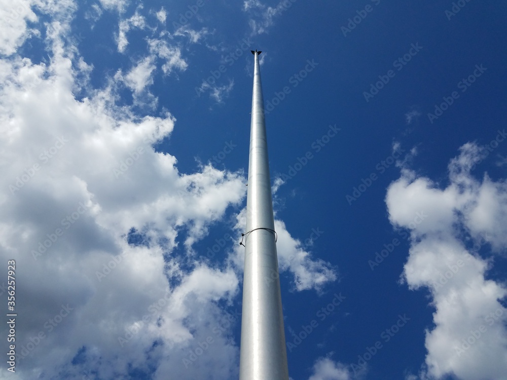 flag pole without a flag and blue sky