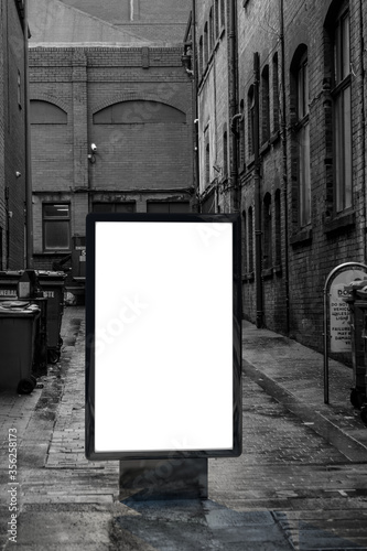 Blank advertising mockup in the street . Poster billboard on city dirty alley background