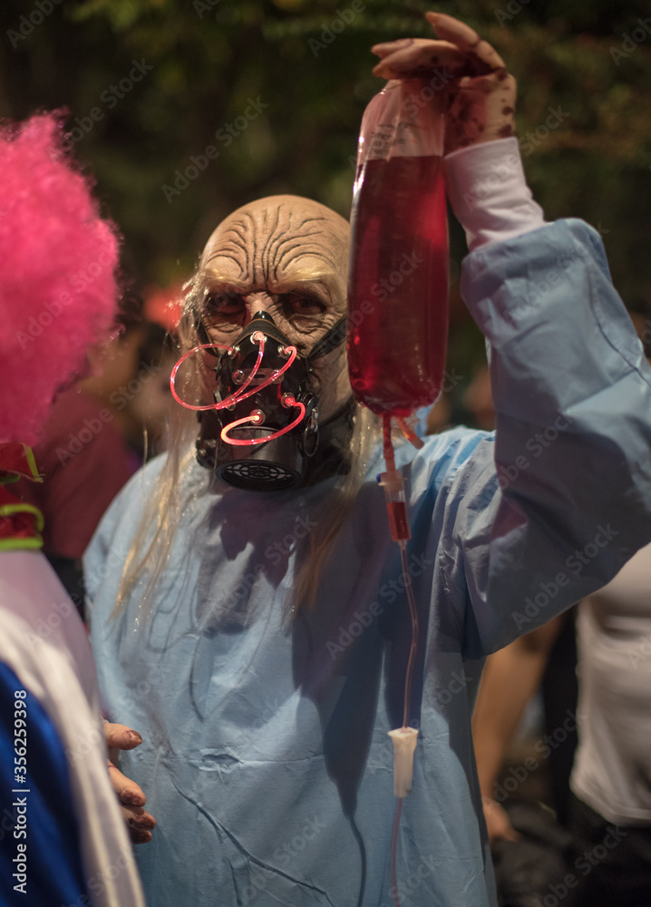 Obraz premium CDMX Mexico / Nov 02 2017 Halloween costumes are costumes worn on or around Halloween, a festival which falls on October 31 Trick or treat, Masked People , Halloween festival or carnival