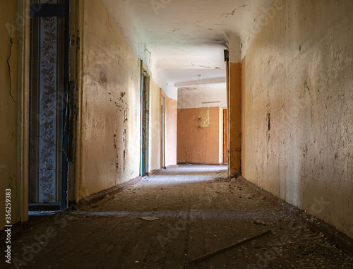 Empty bright corridor in an abandoned building