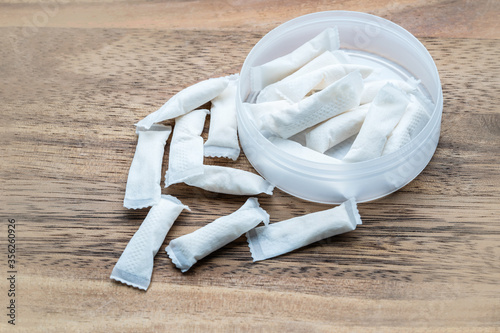 Box of swedish nicotine , snus on wood background photo