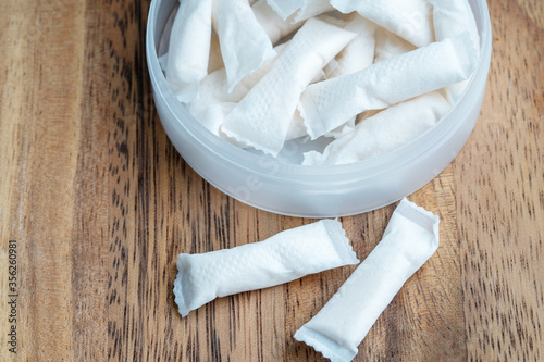 Box of swedish nicotine , snus on wood background