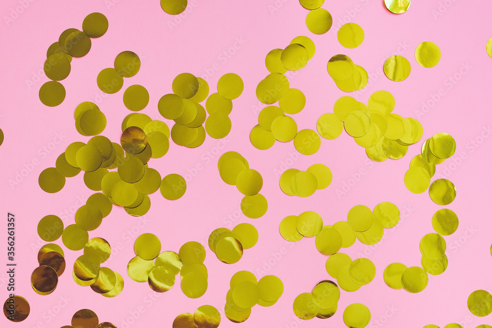 Trendy pink festive backround with golden circle confetti. Celebration, holiday birthday and fashion concept Trendy pink festive backround with golden circle confetti. Celebration, holiday birthday and fashion concept