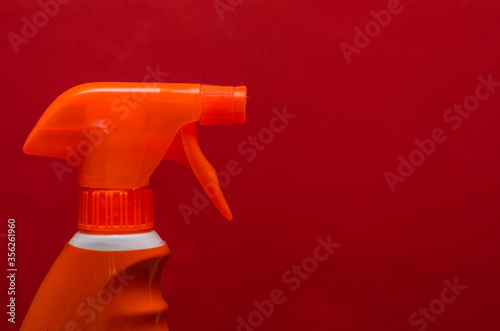 Red and orange spray container 